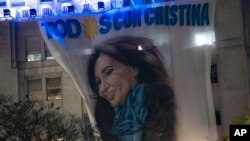 A banner depicting Argentina's Vice President Cristina Fernandez hangs from a government building, Sept. 2, 2022, hours after someone pointed a gun at her outside her home in Buenos Aires, Argentina.