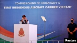 India's Prime Minister Narendra Modi addresses an audience before commissioning India's first home-built aircraft carrier INS Vikrant at a state-run shipyard in Kochi, India, Sept. 2, 2022.