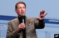 FILE - Larry Ellison, co-founder and chief executive officer of Oracle Corp., waits to meet with then-Japanese Prime Minister Shinzo Abe at the prime minister's official residence in Tokyo, Apr. 8, 2014.