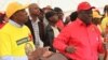 Former Prime Minister and MDC-T leader Morgan Tsvangirai and Mavambo Kusile Dawn party leader Simba Makoni addressing people at Sakubva Stadium, Mutare, Manicaland Province, in the run up to the 2013 general election.