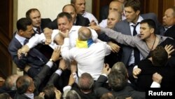 Deputies scuffle during a session in the chamber of the Ukrainian parliament in Kiev, May 24, 2012. 