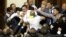 Deputies scuffle during a session in the chamber of the Ukrainian parliament in Kiev, May 24, 2012. 