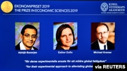 The portraits of Abhijit Banerjee, Esther Duflo, and Michael Kreme, who have been announced the Nobel Prize in Economic Sciences 2019 winners, are seen at a news conference at the Royal Swedish Academy of Sciences in Stockholm, Sweden, October 14,…