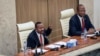 Ethiopia's Prime Minister Abiy Ahmed, left, flanked by House speaker Tagesse Chafo, right, addresses the parliament in the capital Addis Ababa, Ethiopia Nov. 15, 2022.