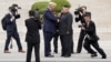 FILE - U.S. President Donald Trump, left, meets with North Korean leader Kim Jong Un at the demilitarized zone separating the two Koreas in Panmunjom, South Korea, June 30, 2019. Kim has shown he is determined to hold onto nuclear weapons, U.S. analysts say. 