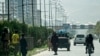 Taliban fighters (C) stand guard along a road near the Russian embassy after a suicide attack in Kabul, Sept. 5, 2022.