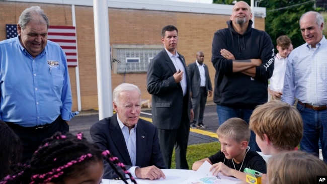 President Joe Biden talks to children before speaking at a United Steelworkers of America Local Union 2227 event in West Mifflin, Pennsylvania, Sept. 5, 2022, to honor workers on Labor Day.