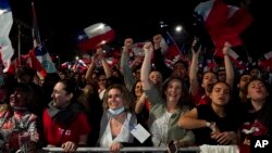 Opponents of the new Constitution celebrate in the streets the results of a plebiscite on whether the new Constitution will replace the current Magna Carta imposed by a military dictatorship 41 years ago, in Santiago, Chile, Sept. 4, 2022. 