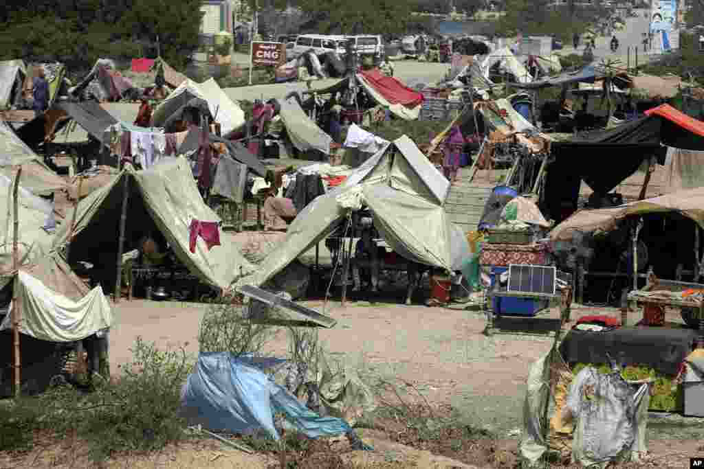 People forced from their homes by flooding take shelter in Jaffarabad, a district of Pakistan's Baluchistan province, Sept. 5, 2022. 