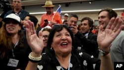 Opponents of the new Constitution cheer as they listen to the partial results of a plebiscite on whether the new Constitution will replace the current Magna Carta imposed by a military dictatorship 41 years ago, in Santiago, Chile, Sept. 4, 2022. 