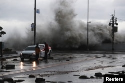 A wave caused by Typhoon Hinnamnor hits the waterfront in Busan, South Korea, September 6, 2022.