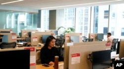 People work at the Yelp office in San Francisco on February, 14, 2023. (AP Photo/Jeff Chiu, File)
