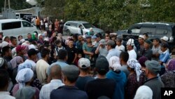 Kyrgyz refugees from Batken, on the Kyrgyz-Tajik border, gather as they arrive at Boz-Adir, southwestern Kyrgyzstan, Sept. 17, 2022, after fighting broke out at the border. The security chiefs of Kyrgyzstan and Tajikistan have sat down for talks to stop the violence.