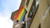 FILE - A woman waves a rainbow flag as she shouts slogans during the LGBTQ Pride March in Istanbul, Turkey, June 26, 2022. 