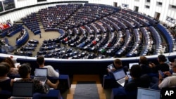 FILE - European Parliament members meet in a plenary session on Sept. 14, 2022, in Strasbourg, France. The Parliament on Nov. 23, 2023, urged Iran "to end immediately all discrimination against women and girls."