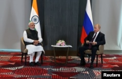 Russian President Vladimir Putin and Indian Prime Minister Narendra Modi attend a meeting on the sidelines of the Shanghai Cooperation Organization summit in Samarkand, Uzbekistan Sept. 16, 2022.