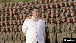 FILE: North Korean leader Kim Jong Un meets troops who have taken part in the military parade to mark the 90th anniversary of the founding of the Korean People's Revolutionary Army, in this undated photo released by North Korea's Korean Central News Agenc