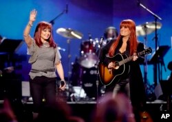 FILE - Naomi Judd, left, and Wynonna Judd, of The Judds, perform at the "Girls' Night Out: Superstar Women of Country," in Las Vegas, April 4, 2011. The Judds were inducted into the Country Music Hall of Fame, May 1, 2022. Naomi Judd died the day before the ceremony.