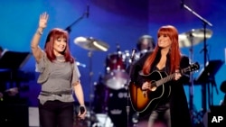 FILE - Naomi Judd, left, and Wynonna Judd, of The Judds, perform at the "Girls' Night Out: Superstar Women of Country," in Las Vegas, April 4, 2011.