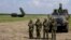 HQ-22 anti-aircraft systems, left, are seen during the military exercises at Batajnica military airfield, near Belgrade, Serbia, April 30, 2022. 