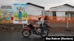 FILE: Congolese people ride a motorcycle past the newly constructed MSF (Doctors Without Borders) Ebola treatment center in Goma in the Democratic Republic of Congo, 8.3.2019