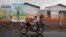 FILE: Congolese people ride a motorcycle past the newly constructed MSF (Doctors Without Borders) Ebola treatment center in Goma in the Democratic Republic of Congo, 8.3.2019