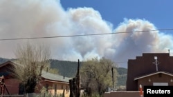 Smoke from the Calf Canyon fire is seen from Mora, NM, April 29, 2022. 