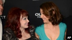 FILE - Ashley Judd, right, and her mother, Naomi Judd, arrive at the LA premiere of "Olympus Has Fallen," at the ArcLight Theatre, March 18, 2013, in Los Angeles.