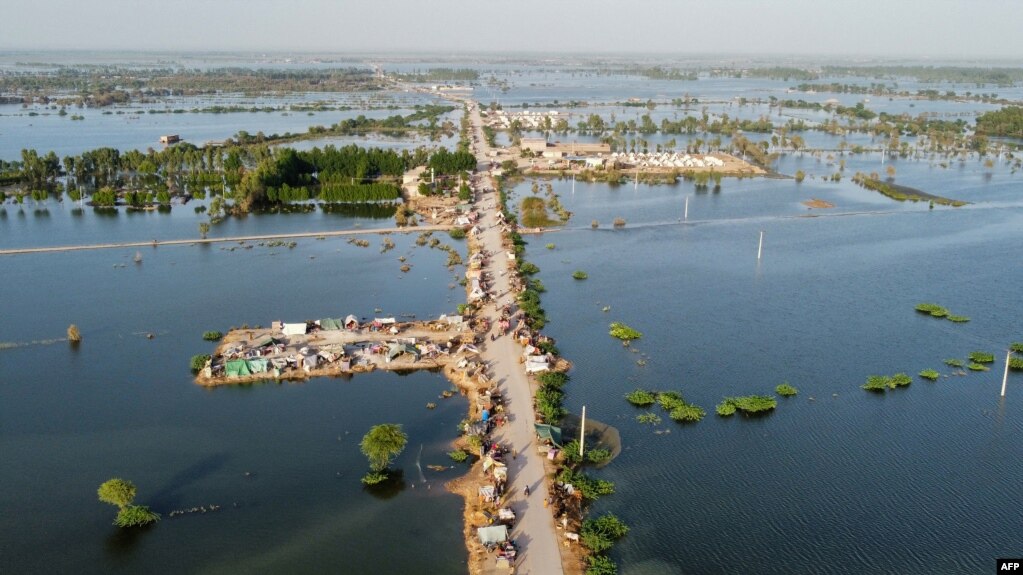This aerial photograph shows makeshift tents for people displaced due to the floods after heavy monsoon rains at Sohbatpur in Jaffarabad district of Balochistan province, Sept. 4, 2022.