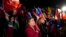 Demonstrators sing the national anthem as they rally against the new proposed Constitution in Santiago, Chile, Sept. 1, 2022. 