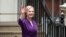 Liz Truss gestures outside the Conservative Party headquarters, after being announced as Britain's next Prime Minister, in London, Sept. 5, 2022. 