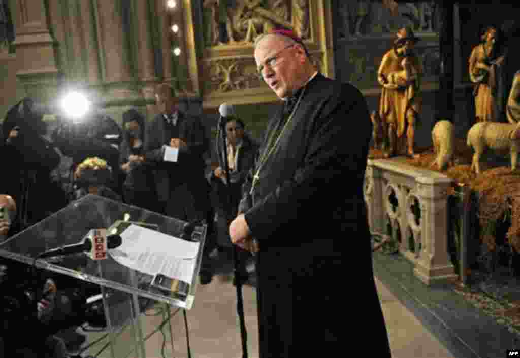 New York Archbishop Timothy Dolan speaks to the media after celebrating mass at Saint Patrick's Cathedral, Friday, Jan 6, 2012, in New York. Cardinal Designate Dolan is one of 22 prelates who will be elevated to cardinal in the Roman Catholic Church in a 