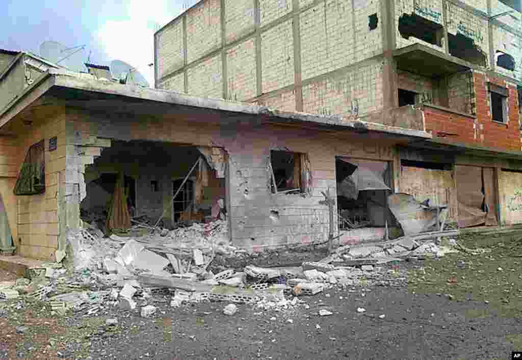 Houses destroyed by Syrian government forces shelling, at Baba Amr neighborhood in Homs province, February 20, 2012. An opposition group says several people have been killed in heavy shelling. (AP/Local Coordination Committees in Syria)