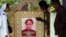 Makam Adelina Sau, di Desa Abi, Warga desa Abi, Oenino, provinsi NTT. Adelina meninggal di Malaysia dalam usia 20 tahun.