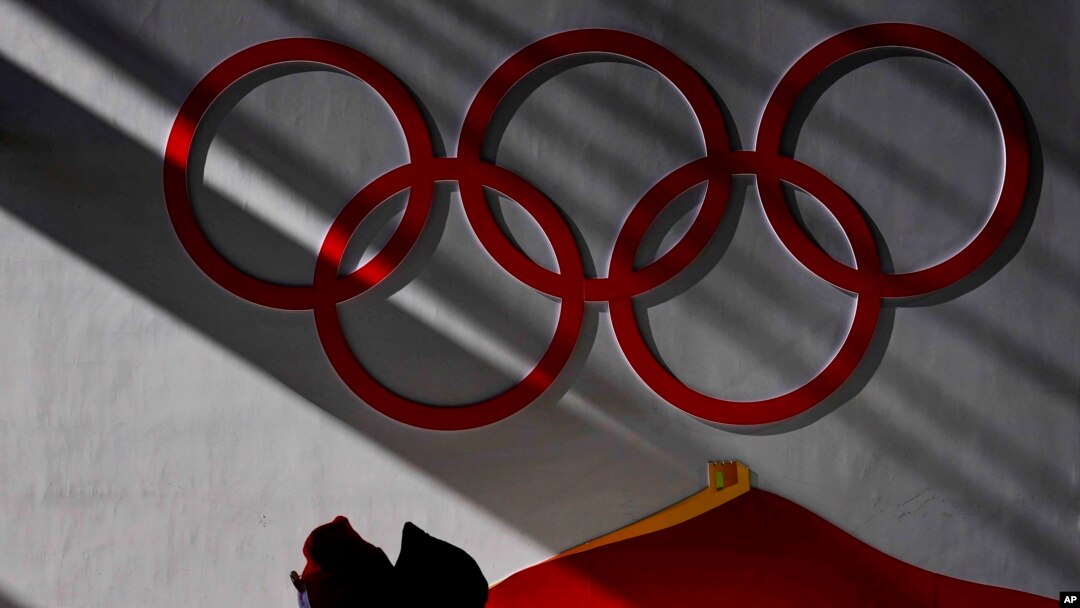 A man walking inside of the Zhangjiakou National Ski Jumping Center, Feb. 2, 2022, in Zhangjiakou, China.