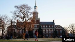 FILE - Students walk on the campus of Howard University, one of six historically Black colleges and universities (HBCUs) across the United States that received bomb threats, in Washington, Jan. 31, 2022.