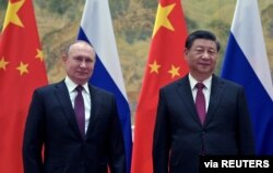 Presiden Rusia Vladimir Putin menghadiri pertemuan dengan Presiden China Xi Jinping di Beijing, China, 4 Februari 2022. (Foto: Sputnik/Aleksey Druzhinin/Kremlin via REUTERS)