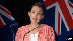 FILE - New Zealand Prime Minister Jacinda Ardern announces the country will move to a COVID red traffic light setting during a press conference at Parliament in Wellington, Jan. 23, 2022.