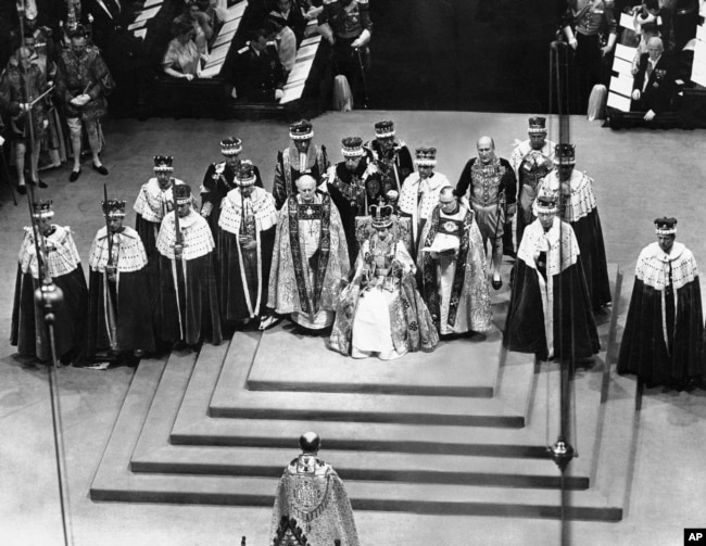 FILE - Queen Elizabeth II sits on throne in Westminister Abbey, London, June 2, 1953 after her coronation. (AP Photo, File)