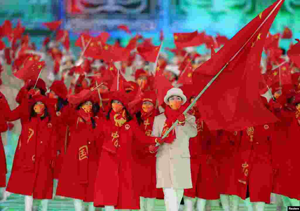 Zhao Dan and Gao Tingyu of China lead their contingent during the athletes parade at the opening ceremony.