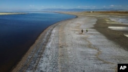 Record-low water levels are seen at the Great Salt Lake, Sept. 6, 2022, near Salt Lake City. A heat wave is breaking records in Utah, where temperatures hit 105 degrees F (40.5 C) on Tuesday. Heat waves are among the many environmental challenges facing the planet.