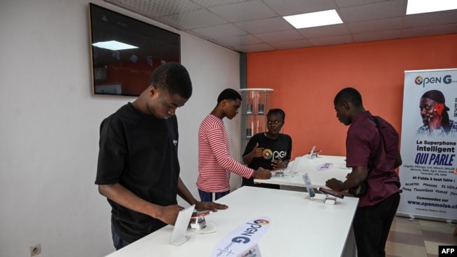 People look at the 'Superphone' Cerco's showroom in Abidjan, Ivory Coast, Aug. 25, 2022.