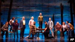 FILE: This image released by Polk & Co. shows the cast for the Tony Award winning musical "Come From Away," in New York. 