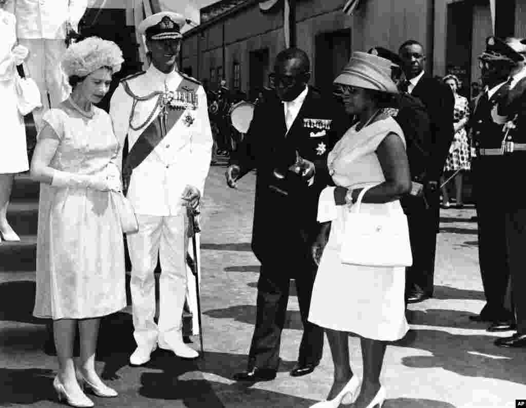 Britain&#39;s Queen Elizabeth II and Prince Philip were greeted by Liberian President William Tubman and his wife Antoinette Padmore Tubman, on their arrival in the capital city of Monrovia for a one-day visit, Nov. 23, 1961. The British monarch, who had just completed an extensive state tour of Ghana, headed for Freetown, Sierra Leone, on her West Africa trip. (AP Photo)