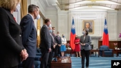In this photo released by the Taiwan Presidential Office, Taiwan's President Tsai Ing-wen, right, meets United States Congressional members led by Florida Democrat Stephanie Murphy in Taipei, Taiwan, Sep. 8, 2022.