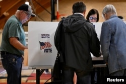 Voters cast their ballots for the midterm primary election in Grove City, Ohio, U.S. May 3, 2022.