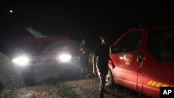 Rescuers arrive at the site of a train collision near Novska, Croatia, Sept. 10, 2022.