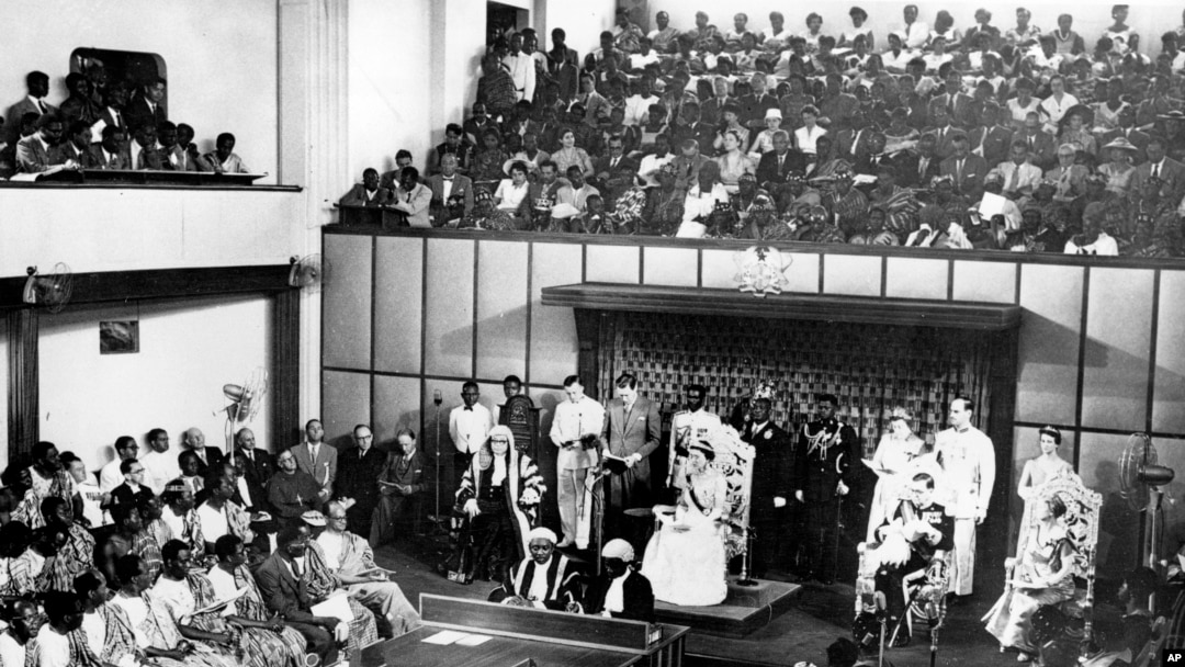 The Duchess of Kent, seated center on dais, reads a message from the Queen of England in the Parliament House at Accra, Ghana, on March 6, 1957.