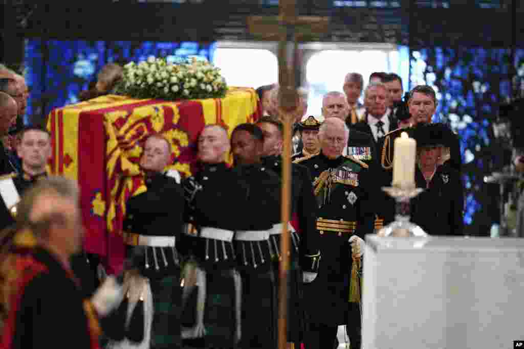 Center from front, Britain&#39;s King Charles III and Camilla, the Queen Consort, Princess Anne and Tim Laurence, and Prince Andrew follow the coffin as they enter the cathedral for a Service of Prayer and Reflection for the Life of Queen Elizabeth II at St. Giles&#39; Cathedral, Edinburgh, Sept. 12, 2022.