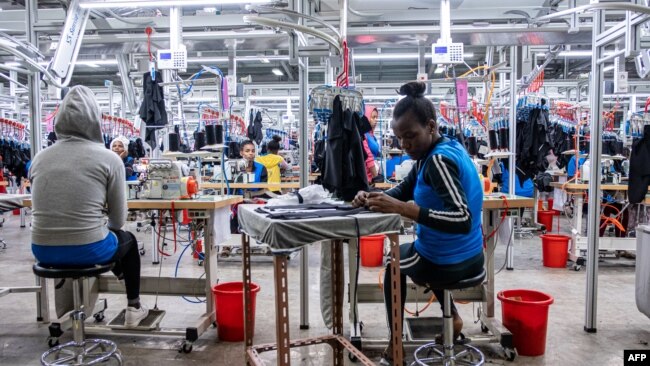 FILE - Women operate sewing machines in a garment factory at the Hawassa Industrial Park, in Hawassa, southern Ethiopia, October 1, 2019.